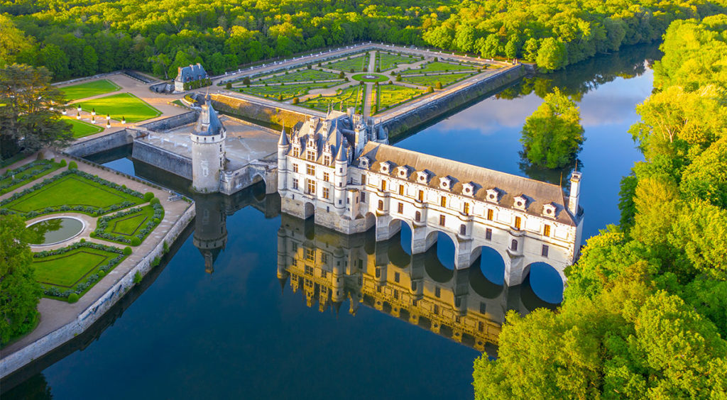 An aerial view of the pure French Renaissance Château de Chenonceau with Diane's garden beyond it and part of Catherine's garden to its left