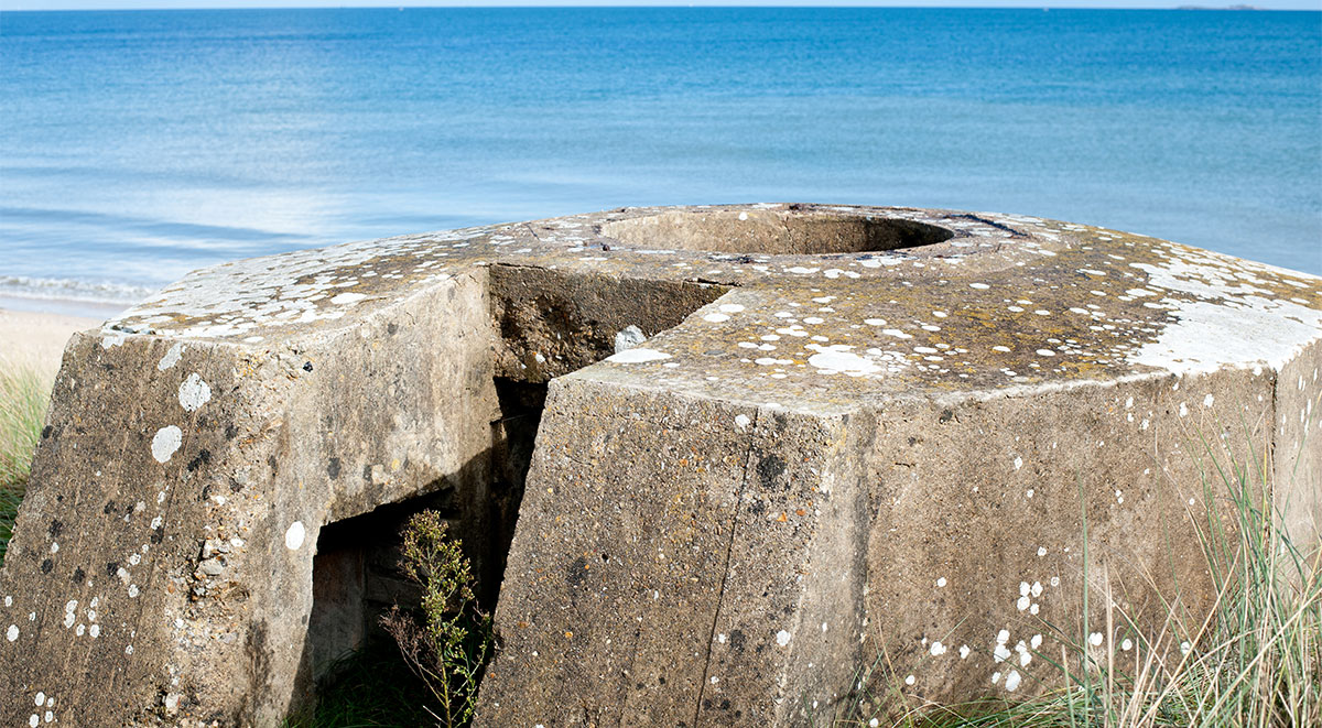 Casemate with original long-range gun at Longues-sur-mer