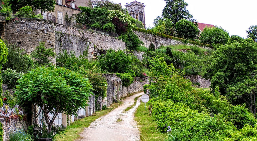 The basilica peaking above the Roman-era ramparts of the village